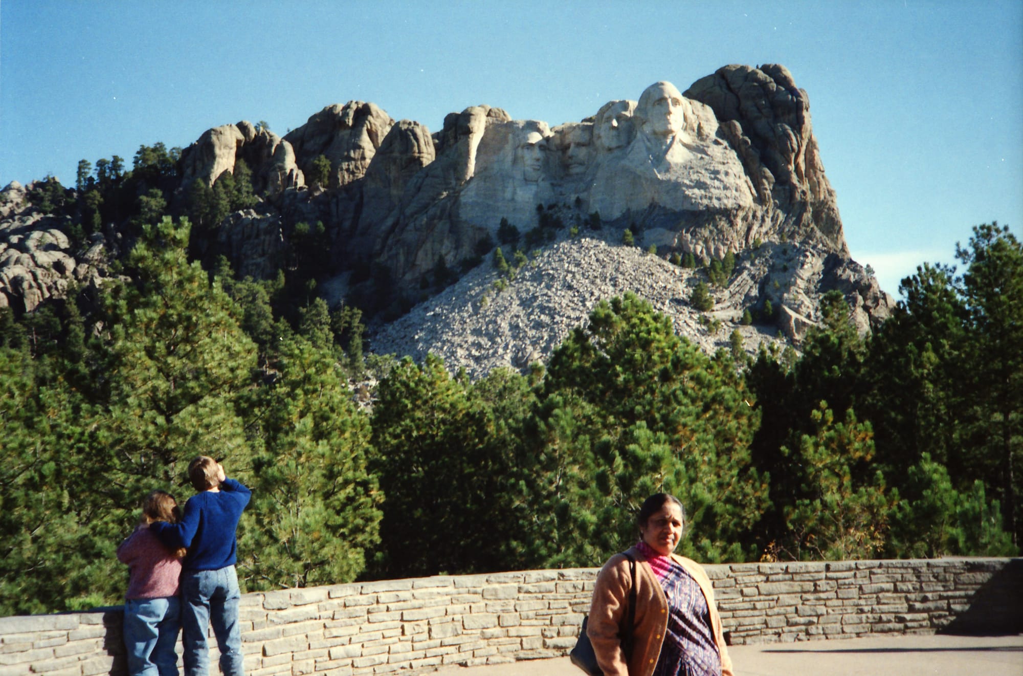 Woman with back to Rushmore. Mount Rushmore, USA