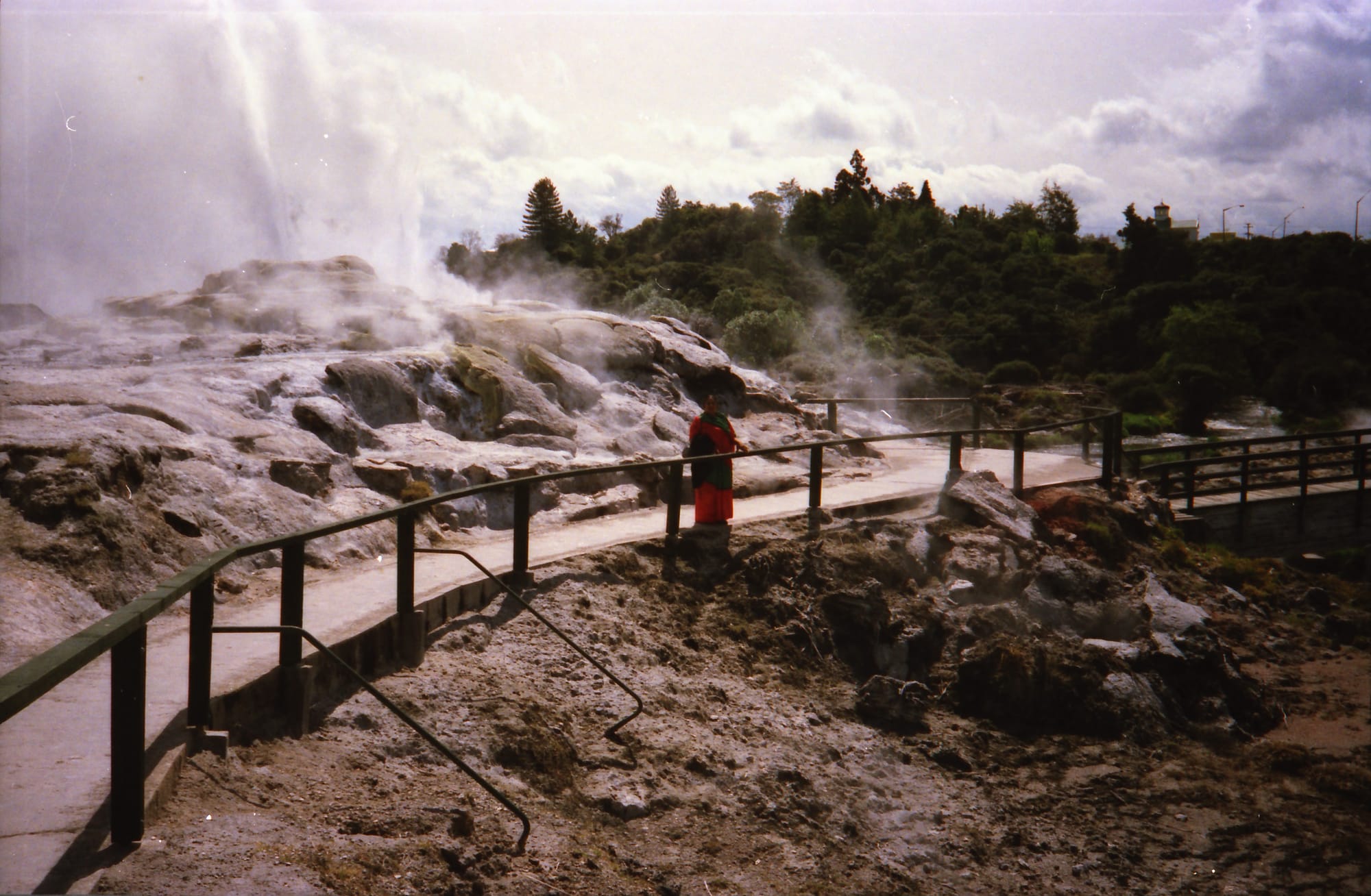 Mataji in Indian dress at a geyser. A geothermal field, location unknown