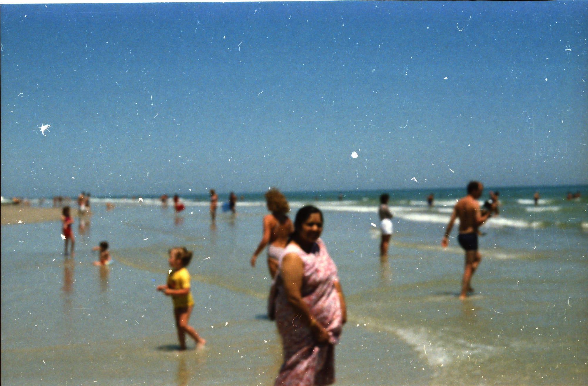 Sari among European bathers. A European beach, location unknown