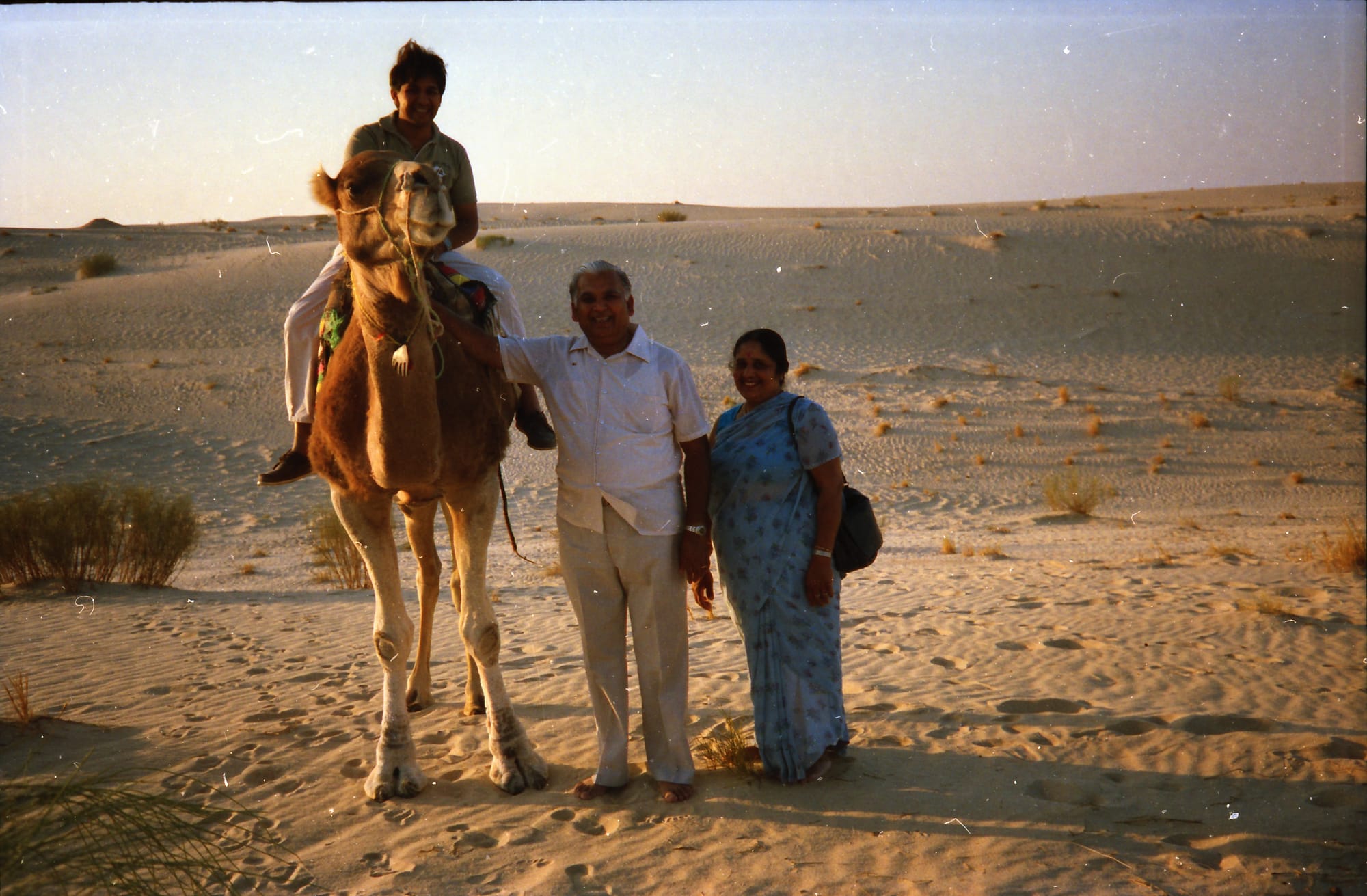 Papaji and Mataji, and a third person on the camel, unidentified. North Africa, country unknown