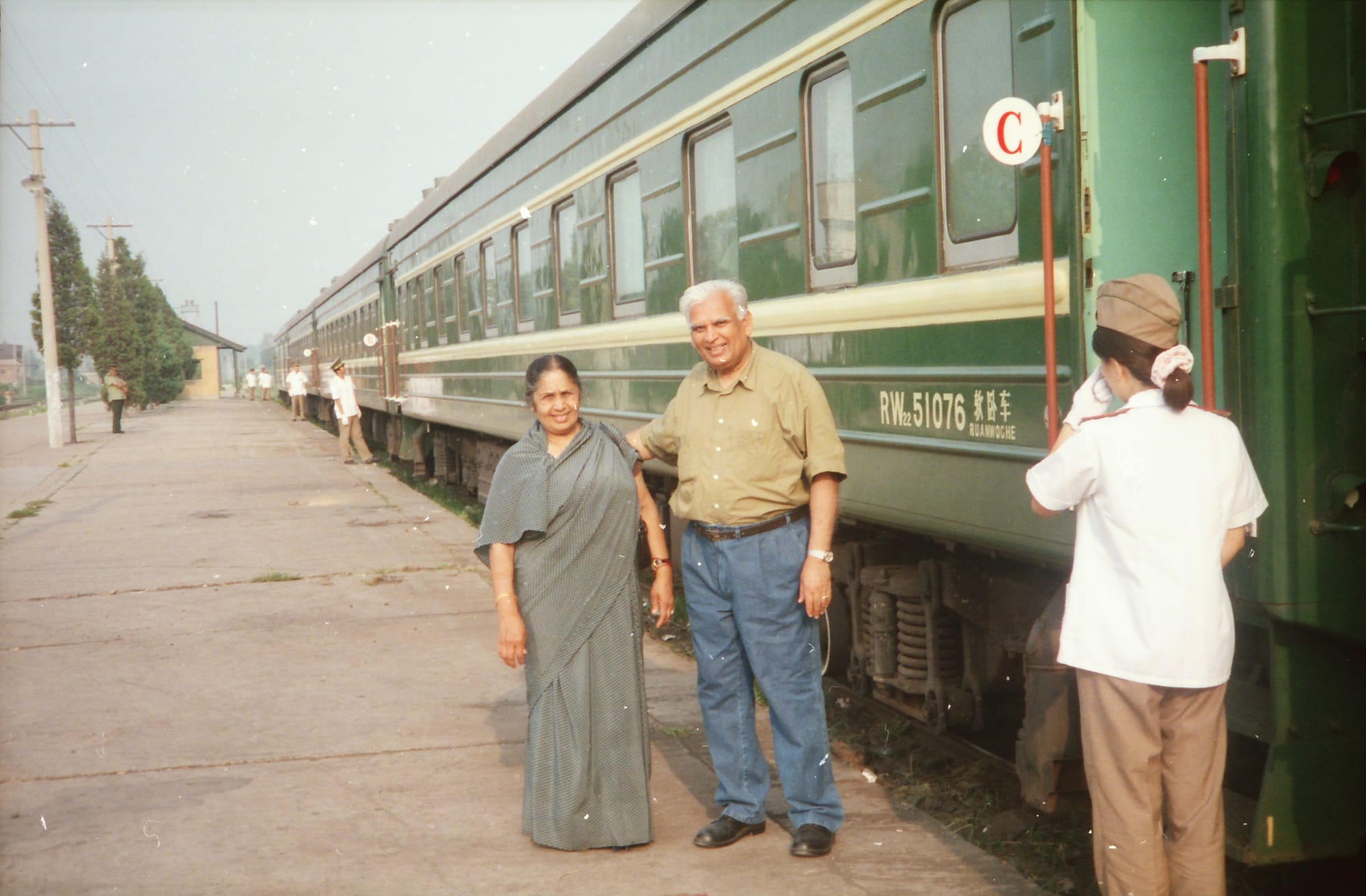 Papaji and Mataji, both grinning at camera. Rural China