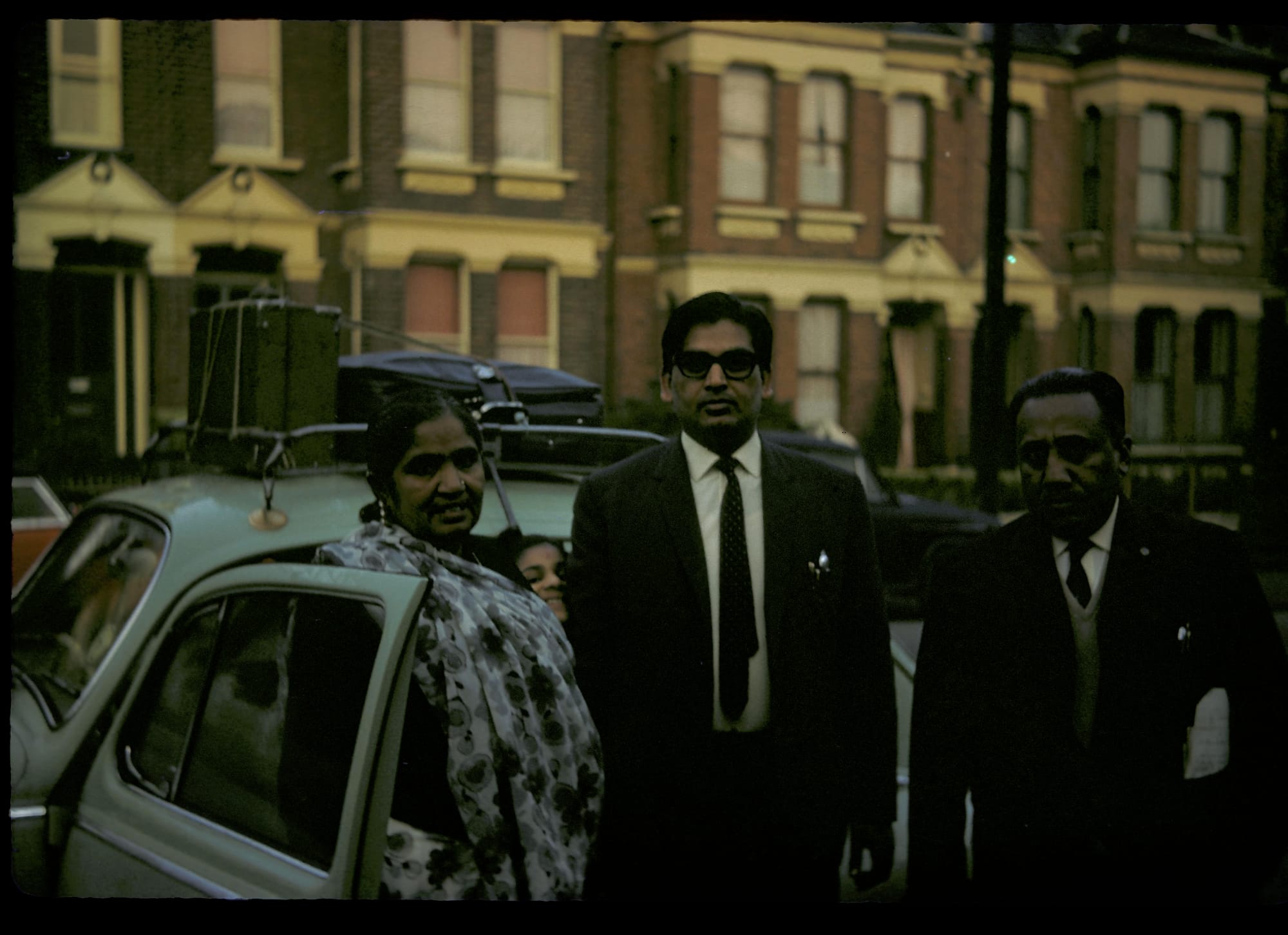 Four people. A street in London