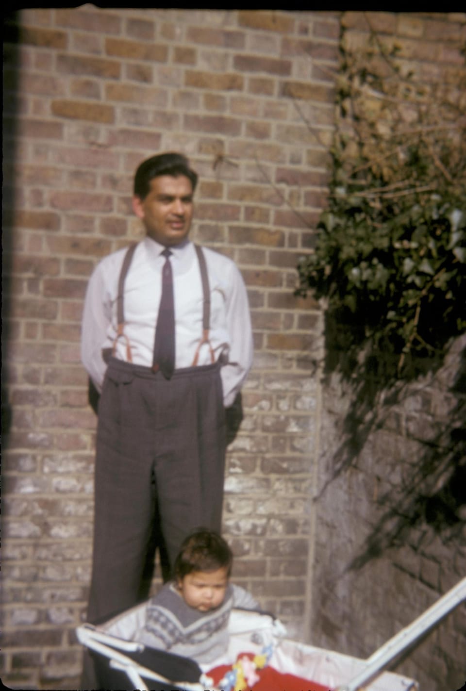 Papaji and Ravi in a pram. England