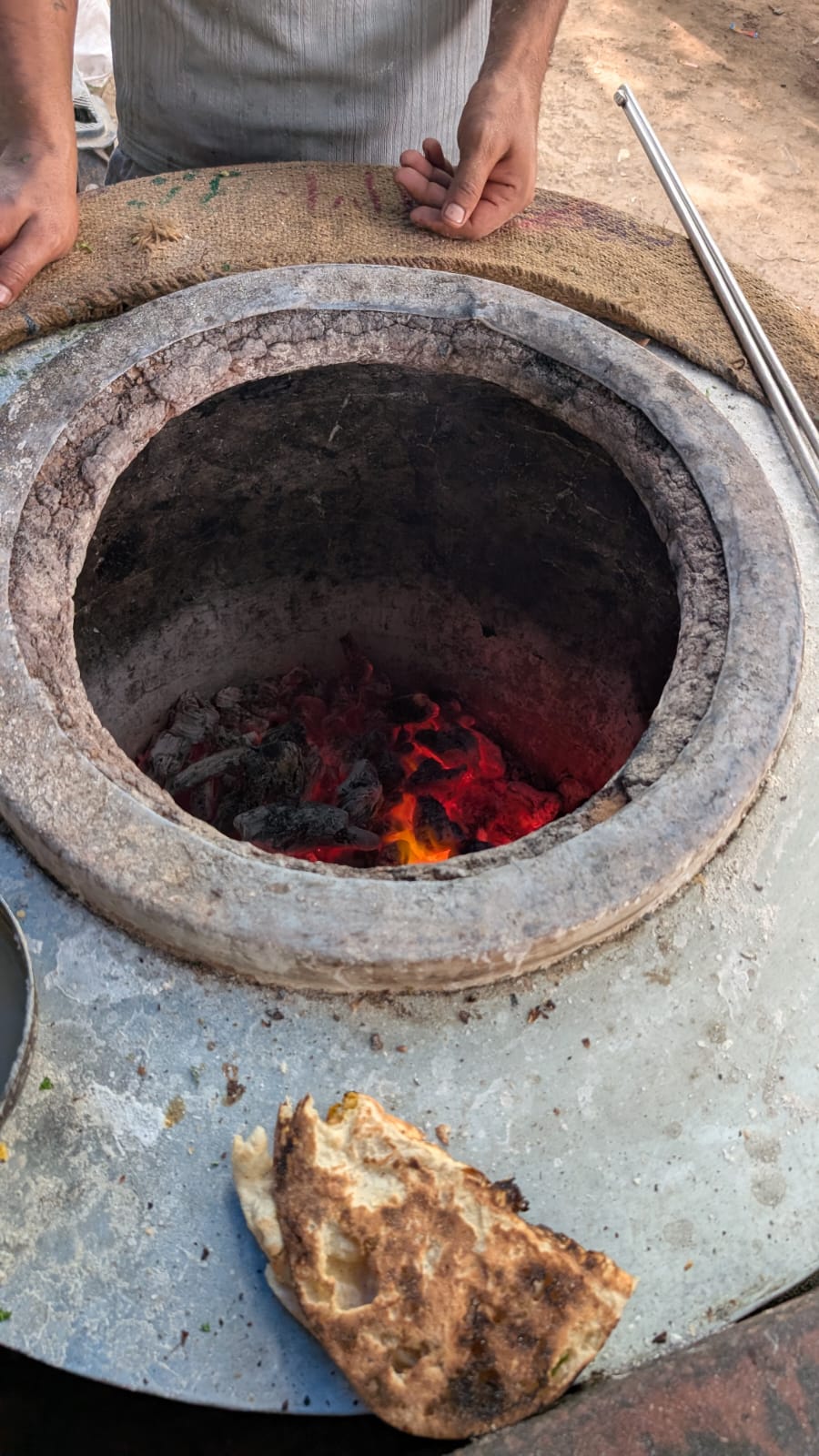 Fresh roti straight off the coals of a roadside tandoor in India.